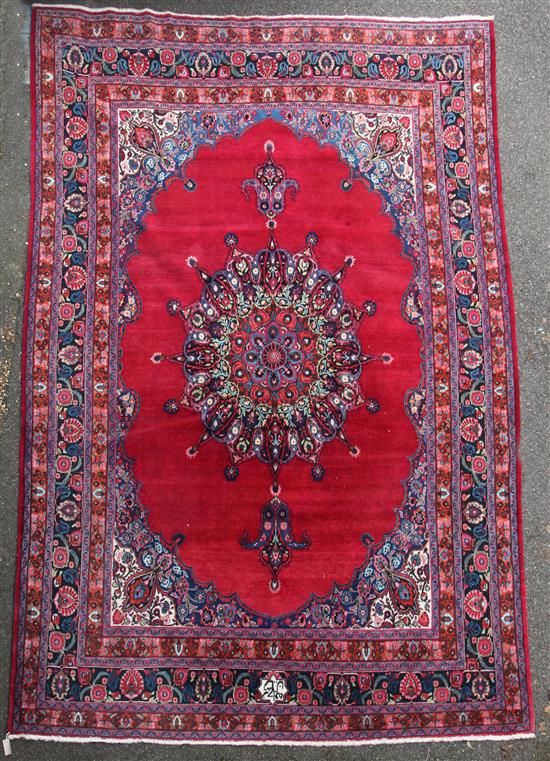A Persian carpet, 12ft 5in by 9ft.